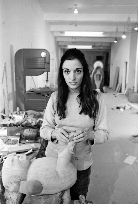 Portrait of Sculptor Marisol Escobar at Work on "The Family" Sculpture