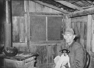 Mot Tucker in the Kitchen of his Corncrib Home, Antioch, Mississippi
