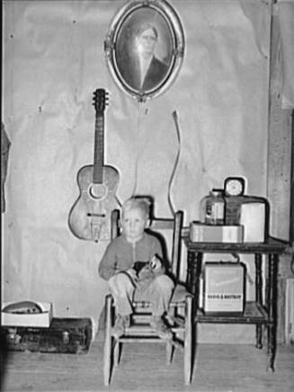 Son of Tenant Farmer in Corner of Living Room, Pace, Mississippi