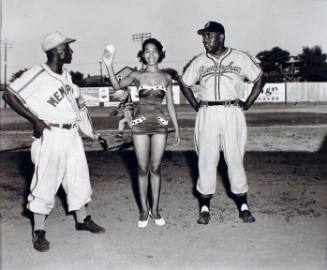 Miss Memphis Red Sox of 1954 with Manager "Goose" Curry (left) and Lyman Bostock Sr. of the Birmingham Black Barons, Martin's Stadium, Memphis