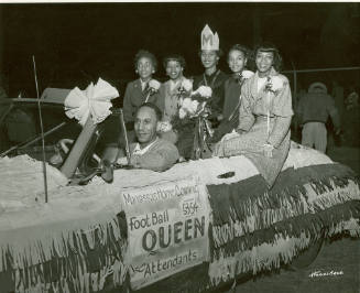 Manassas High School's Queen Barbara Harrison is Seen Seated with her Attendants