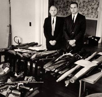 FBI Agents (Bruce Hodges on right) with Weapons Confiscated from Rioters at The University of Mississippi Following the Admission of James Meredith, Oxford, Mississippi