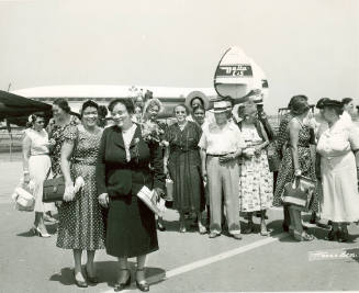 [Mrs. Johnetta Kelso and Others Board Plane]