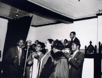 Reverend W. Herbert Brewster, Sr., (standing in rear), and Queen C. Anderson (third from right in profile), East Trigg Baptist Church, Memphis