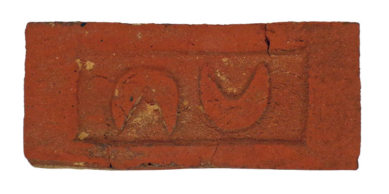Brick Imprinted with Apotropaic Symbols (Double Crescent Moons)