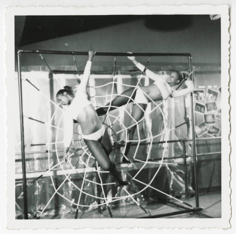 [Two girls posing in dance costumes]