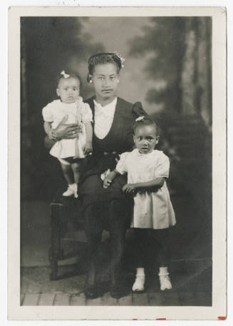 [Woman with two young girls]