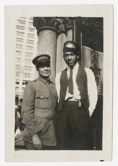 [Two men in uniforms]