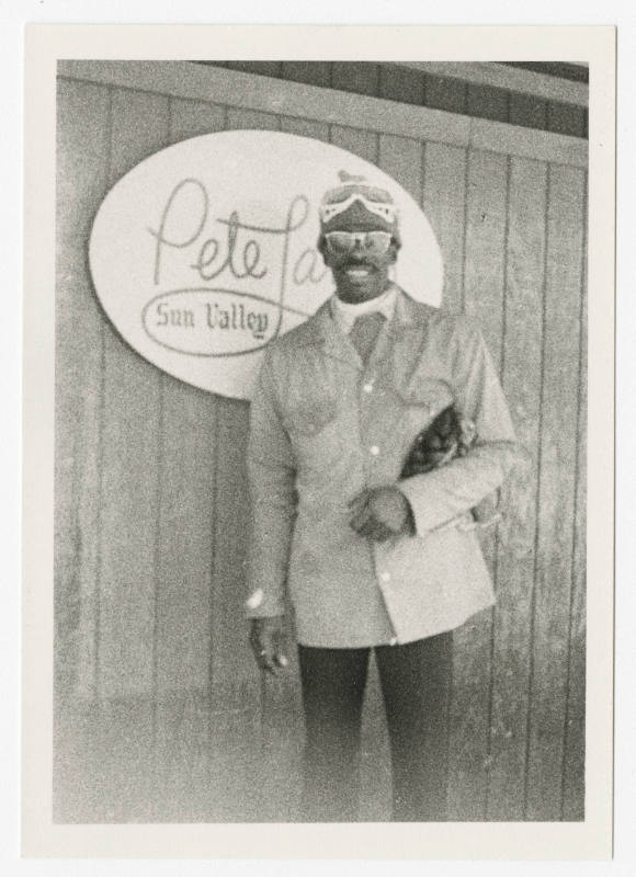 [Man standing in front of sign, Sun Valley, ID]