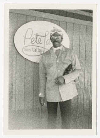 [Man standing in front of sign, Sun Valley, ID]