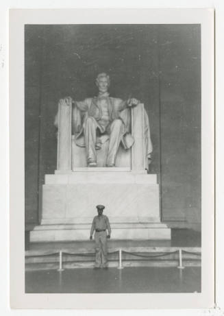 [Man in front of Abraham Lincoln statue, Lincoln Memorial]