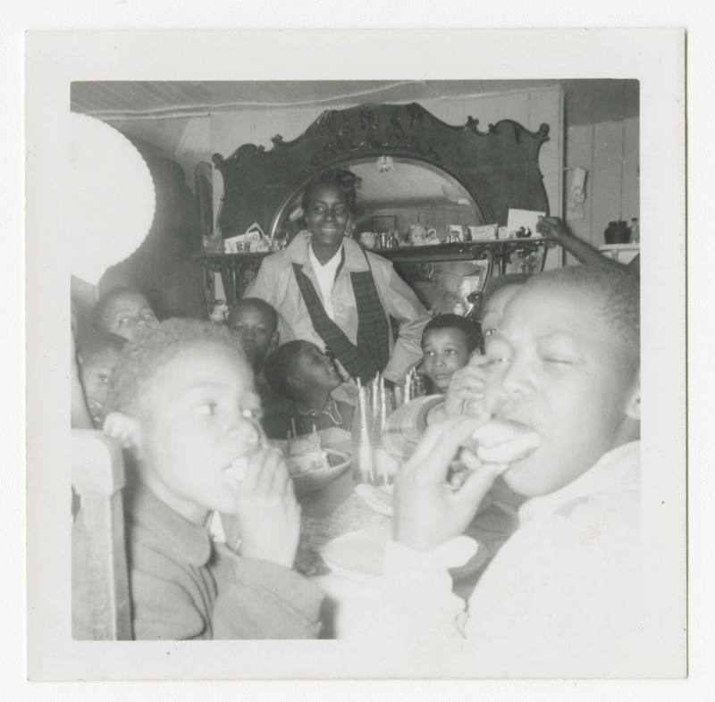 [Group of boys sitting at a table]