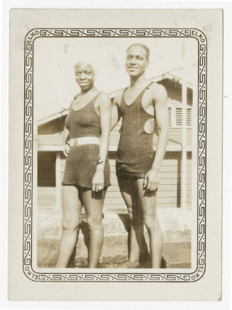 [Man and woman wearing swimsuits]