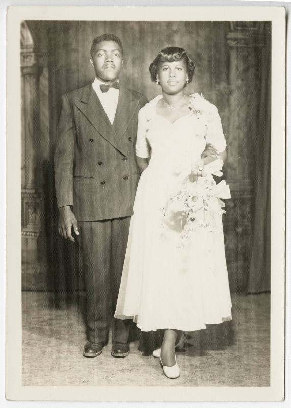 [Young couple posing in studio]