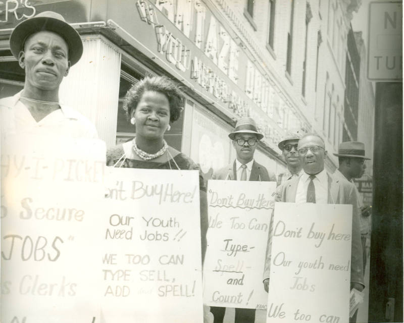[Protesters "Our Youth Need Jobs"]