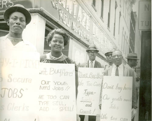 [Protesters "Our Youth Need Jobs"]