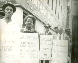 [Protesters "Our Youth Need Jobs"]