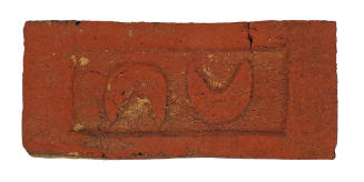 Brick Imprinted with Apotropaic Symbols (Double Crescent Moons)