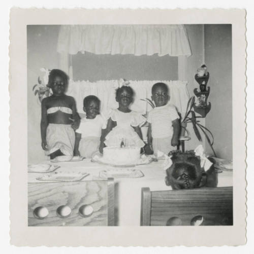 [Group of children at a birthday party]