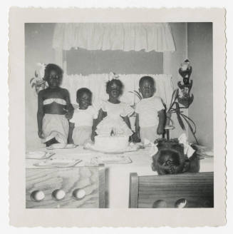[Group of children at a birthday party]