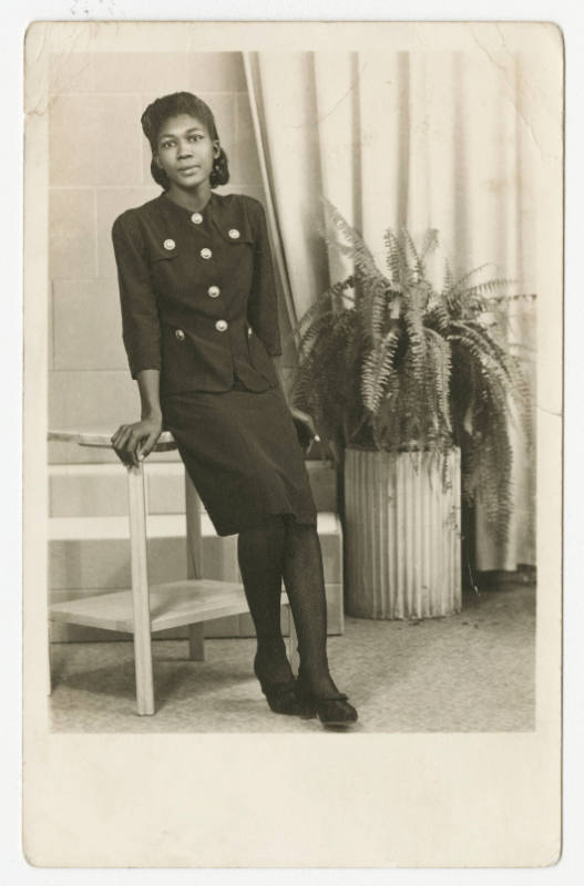 [Woman leaning against a table in a studio, Seguin, TX]