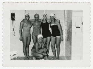 [Five women wearing swimsuits indoors]