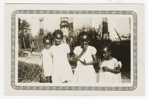 [Four young girls standing outside]