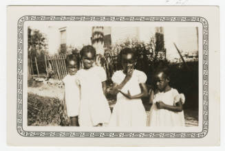 [Four young girls standing outside]